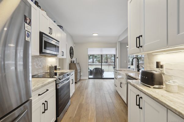 Interior, Kitchen, Recessed Lighting, Stainless Steel Appliances, Wood Texture Flooring