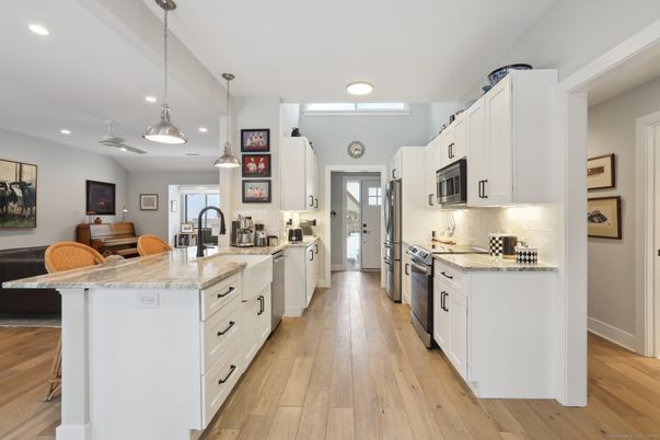 Interior, Kitchen, Pendant Lights, Recessed Lighting, Stainless Steel Appliances, Wood Texture Flooring