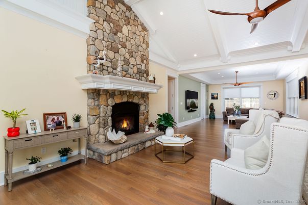 Dining room, Fireplace, Interior, Living room, Recessed Lighting, Stone Walls, Wood Texture Flooring