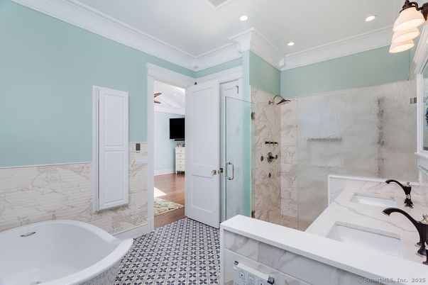 Bathroom, Free Standing Baths, Glass Shower, Interior, Marble Walls, Recessed Lighting, Wood Texture Flooring