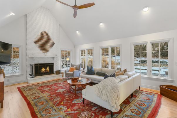 Fireplace, Interior, Living room, Recessed Lighting, Stone Walls, Wood Texture Flooring