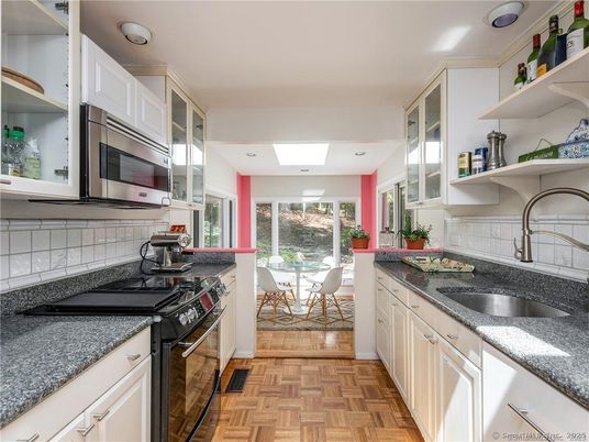 Dining room, Interior, Kitchen, Recessed Lighting, Stainless Steel Appliances, Wood Texture Flooring