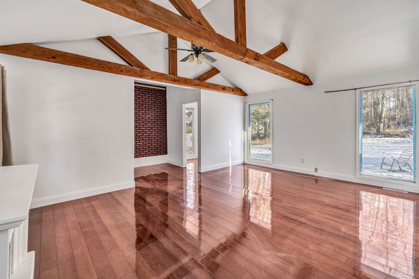 Empty room, Fireplace, Interior, Stone Walls, Wooden Beams, Wood Texture Flooring