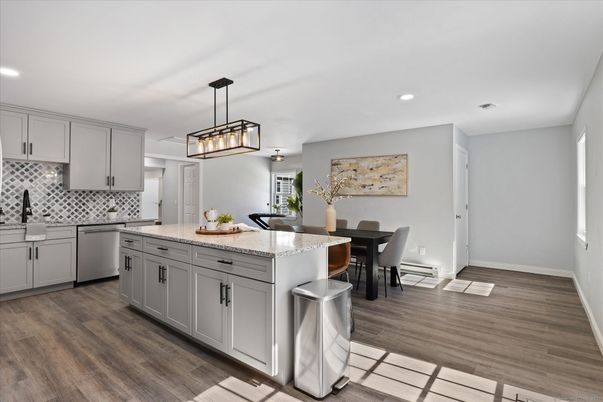 Dining room, Interior, Kitchen, Pendant Lights, Recessed Lighting, Stainless Steel Appliances, Wood Texture Flooring