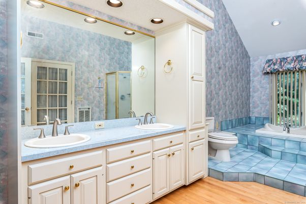Bathroom, Dual Sink Vanities, Interior, Recessed Lighting, Tile Countertops, Wood Texture Flooring