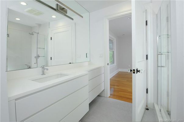 Bathroom, Dual Sink Vanities, Interior, Recessed Lighting, Wood Texture Flooring