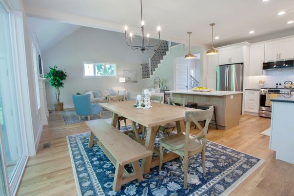 Chandelier, Dining room, Interior, Kitchen, Living room, Pendant Lights, Recessed Lighting, Stainless Steel Appliances, Wood Texture Flooring