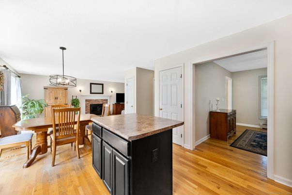Dining room, Fireplace, Interior, Pendant Lights, Wood Texture Flooring