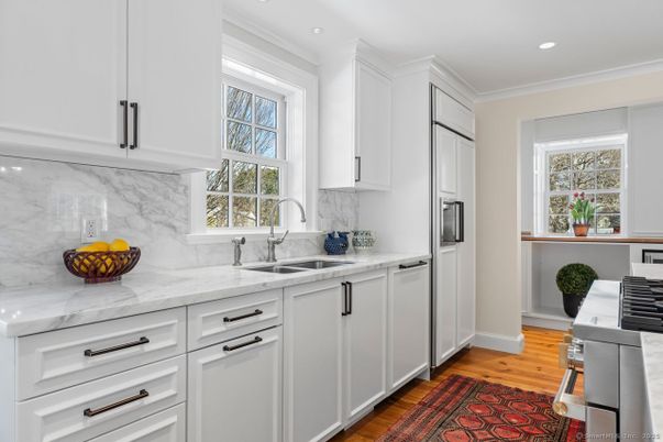 Interior, Kitchen, Marble Walls, Recessed Lighting, Stainless Steel Appliances, Wood Texture Flooring