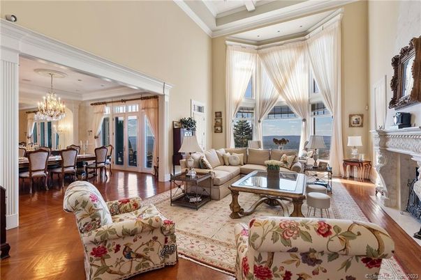 Chandelier, Dining room, Fireplace, Interior, Living room, Recessed Lighting, Water, Wood Texture Flooring
