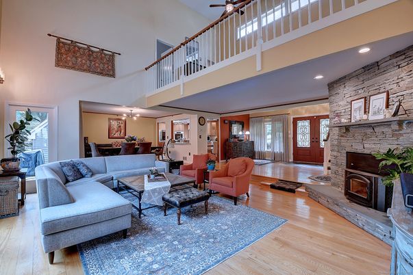Dining room, Fireplace, Interior, Living room, Recessed Lighting, Stone Walls, Wood Texture Flooring