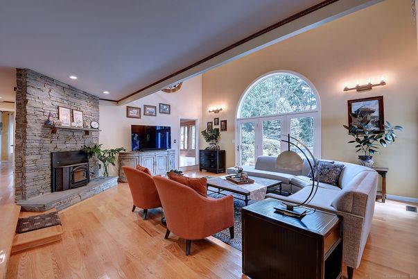 Fireplace, Interior, Living room, Recessed Lighting, Stone Walls, Wood Texture Flooring
