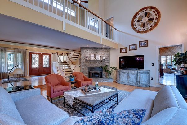 Fireplace, Interior, Living room, Recessed Lighting, Stone Walls, Wood Texture Flooring