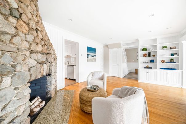 Fireplace, Interior, Living room, Recessed Lighting, Stone Walls, Wood Texture Flooring