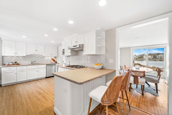 Dining room, Interior, Kitchen, Recessed Lighting, Stainless Steel Appliances, Wood Texture Flooring
