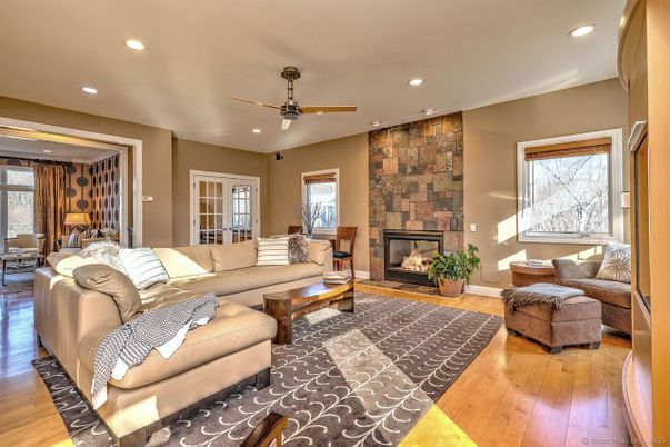Fireplace, Interior, Living room, Recessed Lighting, Stone Walls, Wood Texture Flooring
