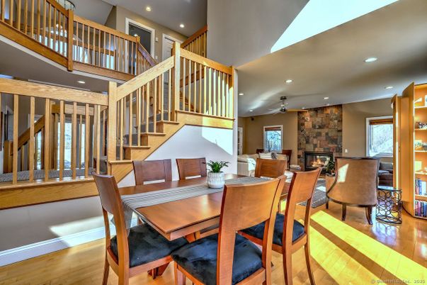 Dining room, Fireplace, Interior, Recessed Lighting, Stone Walls, Wood Texture Flooring