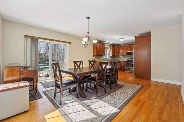 Chandelier, Dining room, Interior, Kitchen, Pendant Lights, Stainless Steel Appliances, Wood Texture Flooring