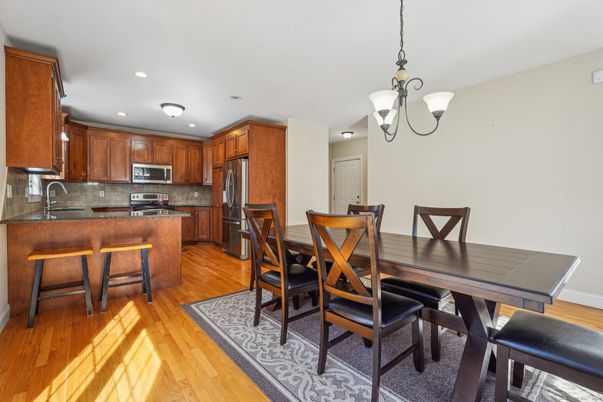 Dining room, Interior, Kitchen, Pendant Lights, Recessed Lighting, Stainless Steel Appliances, Wood Texture Flooring
