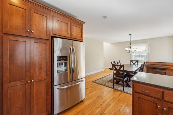Chandelier, Dining room, Interior, Kitchen, Stainless Steel Appliances, Wood Texture Flooring