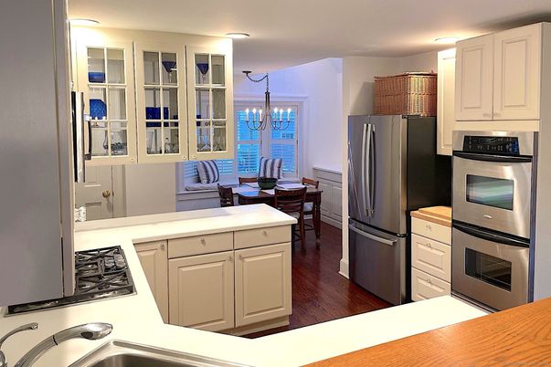 Chandelier, Dining room, Interior, Kitchen, Living room, Stainless Steel Appliances, Wood Texture Flooring