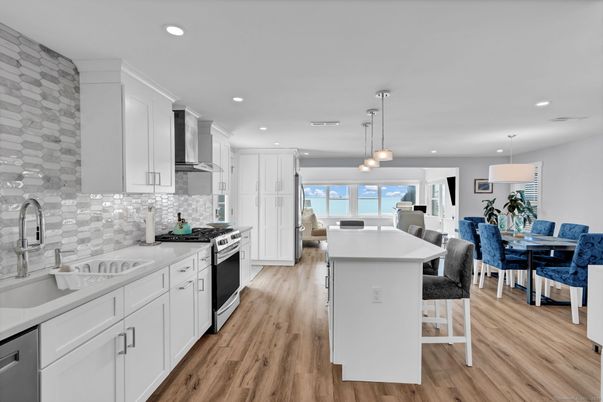 Dining room, Interior, Kitchen, Pendant Lights, Recessed Lighting, Stainless Steel Appliances, Wood Texture Flooring