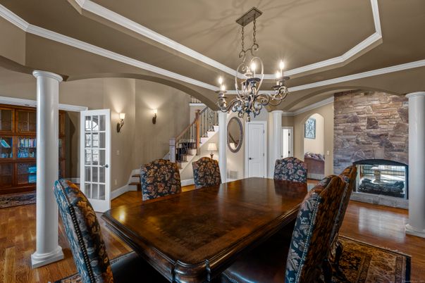 Chandelier, Dining room, Fireplace, Interior, Stone Walls, Wood Texture Flooring