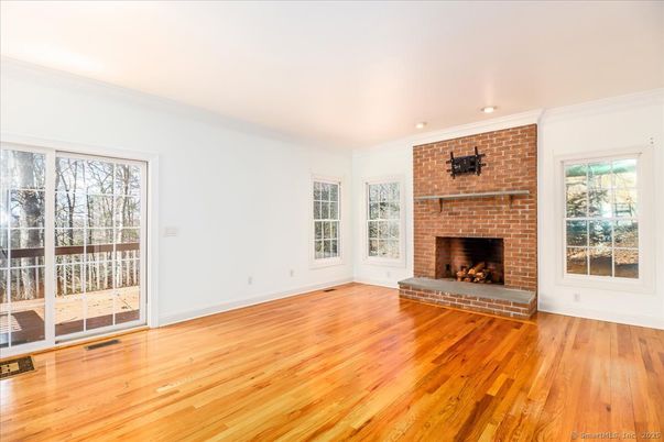Empty room, Fireplace, Interior, Recessed Lighting, Stone Walls, Wood Texture Flooring