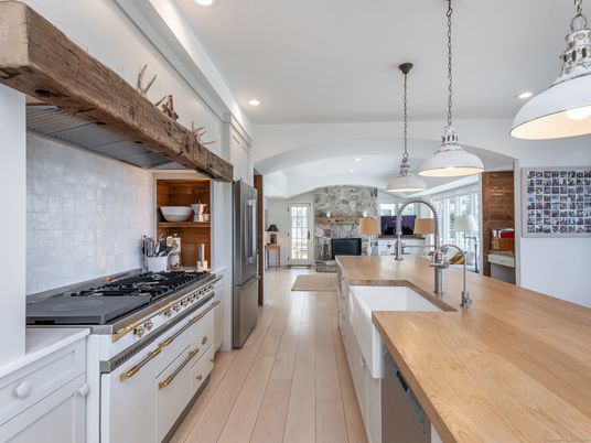 Fireplace, Interior, Kitchen, Pendant Lights, Recessed Lighting, Stainless Steel Appliances, Stone Walls, Wood Texture Flooring