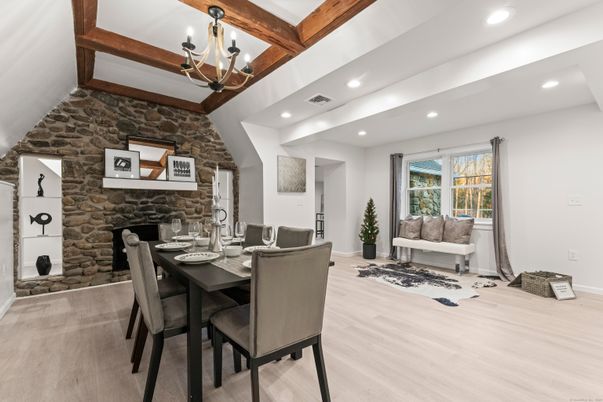 Chandelier, Dining room, Fireplace, Interior, Recessed Lighting, Stone Walls, Wooden Beams, Wood Texture Flooring