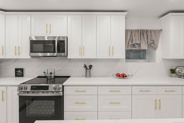 Interior, Kitchen, Marble Walls, Recessed Lighting, Stainless Steel Appliances