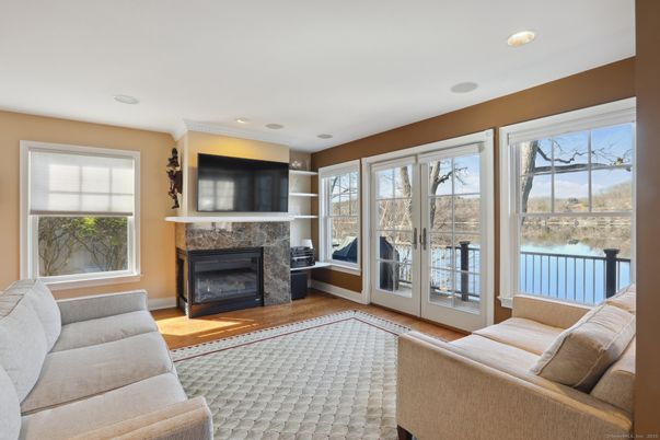 Fireplace, Interior, Living room, Recessed Lighting, Water, Wood Texture Flooring