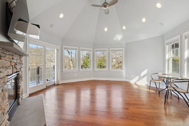 Dining room, Fireplace, Interior, Recessed Lighting, Stone Walls, Wood Texture Flooring