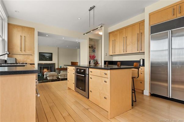 Fireplace, Interior, Kitchen, Living room, Pendant Lights, Recessed Lighting, Stainless Steel Appliances, Wood Texture Flooring