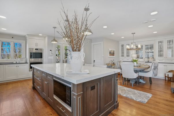 Chandelier, Dining room, Interior, Kitchen, Pendant Lights, Recessed Lighting, Stainless Steel Appliances, Wood Texture Flooring