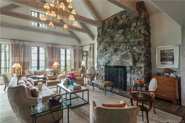 Chandelier, Fireplace, Interior, Living room, Stone Walls, Wooden Beams, Wood Texture Flooring