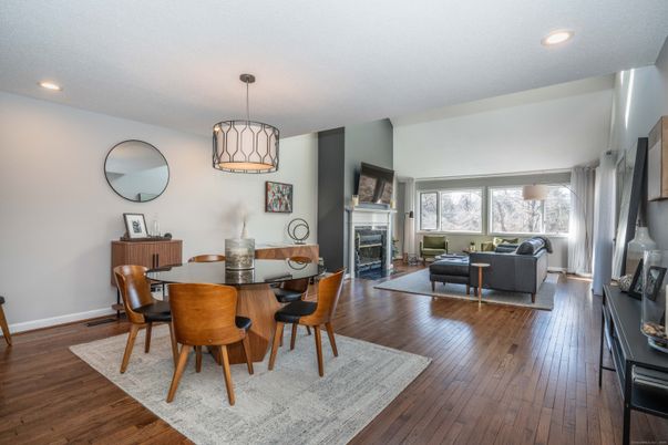 Dining room, Fireplace, Interior, Living room, Pendant Lights, Recessed Lighting, Wood Texture Flooring