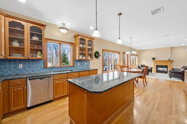 Dining room, Fireplace, Interior, Kitchen, Living room, Pendant Lights, Recessed Lighting, Stainless Steel Appliances, Wood Texture Flooring