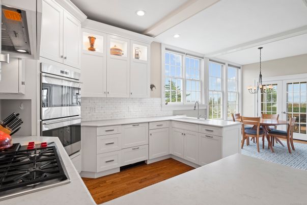 Chandelier, Dining room, Interior, Kitchen, Recessed Lighting, Stainless Steel Appliances, Wood Texture Flooring