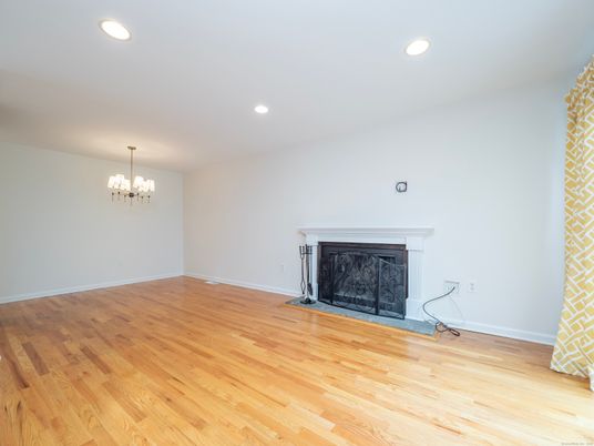 Chandelier, Empty room, Fireplace, Interior, Recessed Lighting, Wood Texture Flooring
