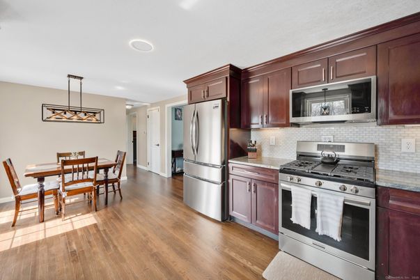 Dining room, Interior, Kitchen, Pendant Lights, Recessed Lighting, Stainless Steel Appliances, Wood Texture Flooring
