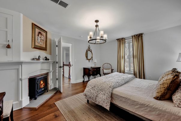 Bedroom, Chandelier, Fireplace, Interior, Pendant Lights, Wood Texture Flooring