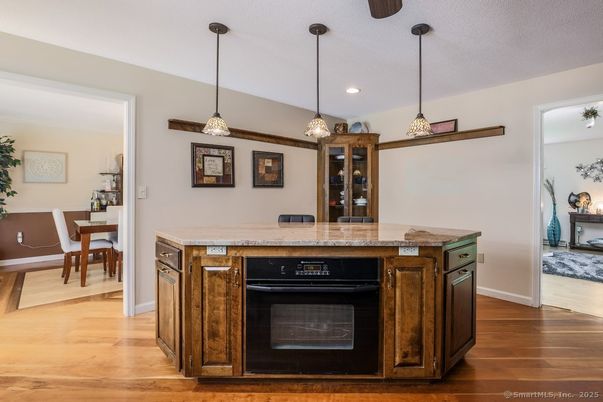 Dining room, Fireplace, Interior, Kitchen, Pendant Lights, Recessed Lighting, Wood Texture Flooring