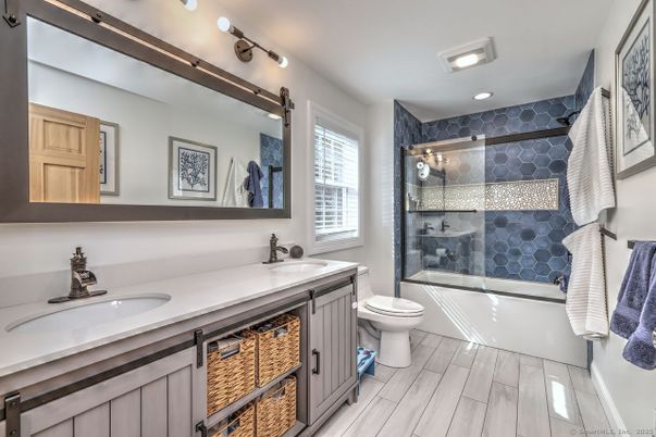 Bathroom, Dual Sink Vanities, Glass Shower, Interior, Recessed Lighting, Wood Texture Flooring