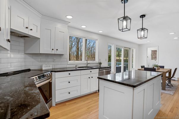 Dining room, Interior, Kitchen, Pendant Lights, Recessed Lighting, Stainless Steel Appliances, Wood Texture Flooring
