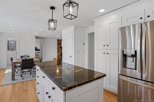 Dining room, Interior, Kitchen, Pendant Lights, Recessed Lighting, Stainless Steel Appliances, Wood Texture Flooring