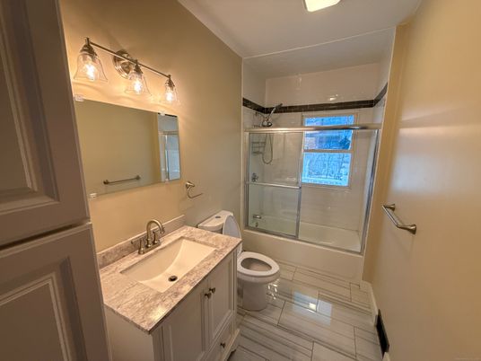 Bathroom, Dual Sink Vanities, Glass Shower, Interior, Wood Texture Flooring