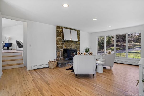 Fireplace, Interior, Living room, Recessed Lighting, Stone Walls, Wood Texture Flooring