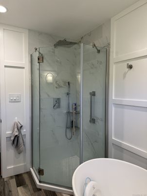 Bathroom, Glass Shower, Interior, Marble Walls, Recessed Lighting, Wood Texture Flooring