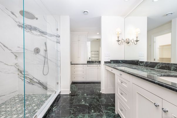 Bathroom, Dual Sink Vanities, Glass Shower, Interior, Marble, Marble Walls, Recessed Lighting